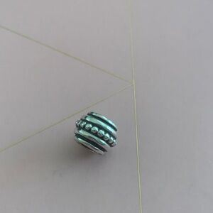 RETIRED Genuine Pandora Silver Charm - “Hopi”
Circa early 2000